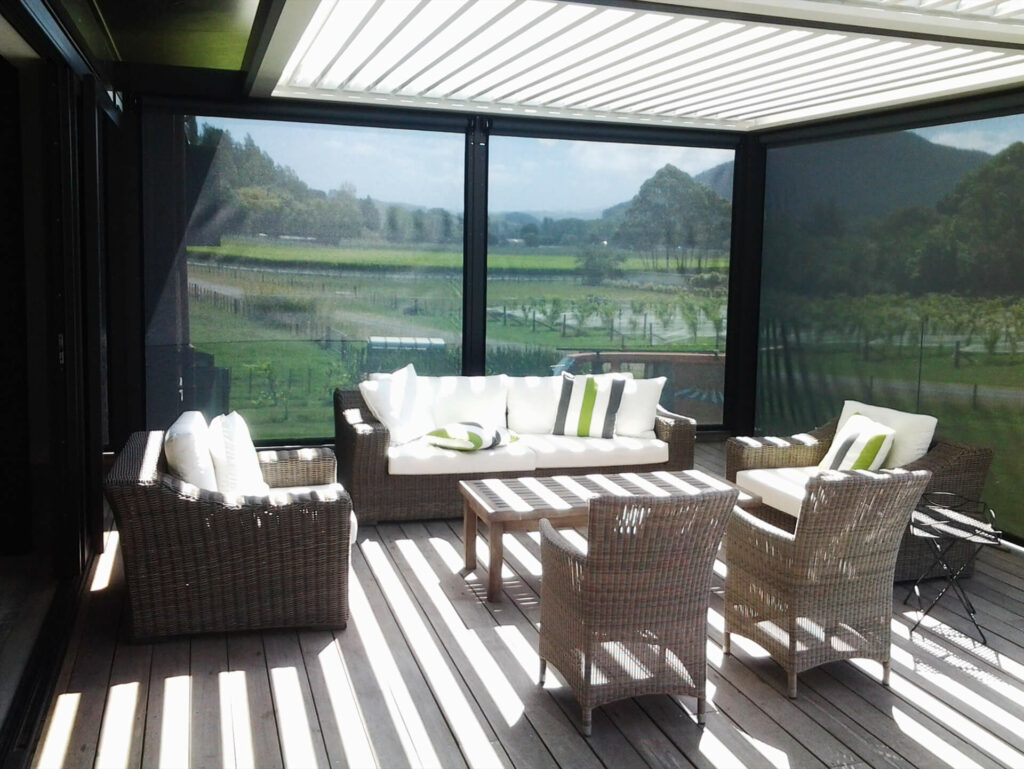 ZipTrak Outdoor Blinds closed to fuly enclose outdoor decking with Louvre Roof